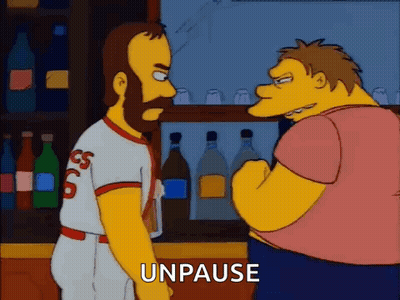 A Cartoon Of Two Men Standing Next To Each Other In A Bar With The Words `` Unpause '' Written Below Them . GIF