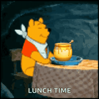 A Cartoon Of Winnie The Pooh Sitting At A Table With A Jar Of Honey And The Words Lunch Time Below Him GIF