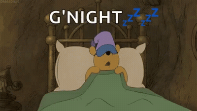 A Cartoon Of Winnie The Pooh Sleeping In A Bed With A Sleep Mask On . GIF