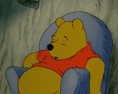 A Cartoon Of Winnie The Pooh Sleeping In A Chair With His Eyes Closed GIF
