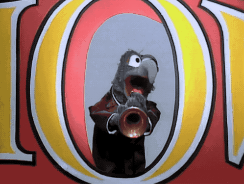 A Cartoon Parrot Is Playing A Trumpet In Front Of The Letter O. GIF