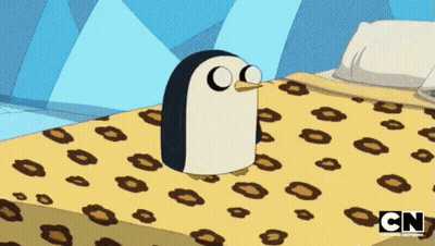 A Cartoon Penguin Is Sitting On A Bed With A Cn Logo On The Bottom GIF