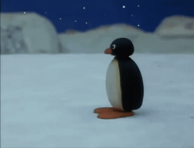 A Cartoon Penguin Is Standing In The Snow Looking Up At The Sky . GIF