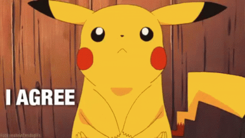 A Cartoon Pikachu Says I Agree In Front Of A Wooden Background GIF