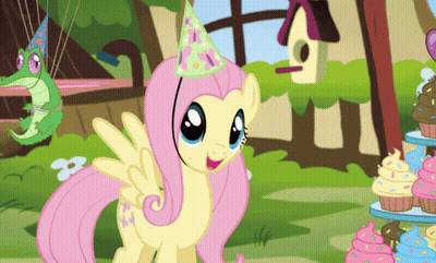 A Cartoon Pony Wearing A Party Hat Is Standing In Front Of Cupcakes GIF