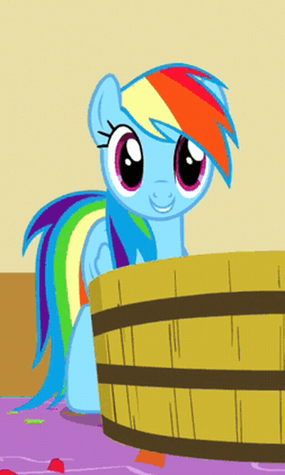 A Cartoon Pony With A Rainbow Mane Is Sitting In A Wooden Bucket GIF