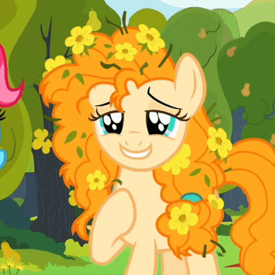 A Cartoon Pony With Orange Hair And Yellow Flowers On It GIF