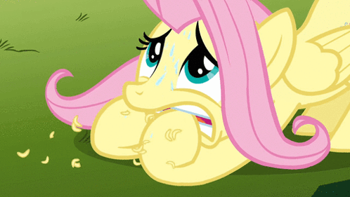 A Cartoon Pony With Pink Hair Is Laying On The Ground And Crying GIF