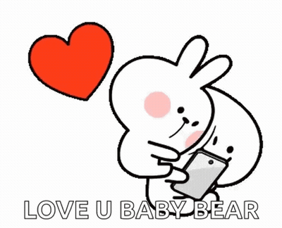 A Cartoon Rabbit Is Holding A Cell Phone And A Heart Is Flying In The Background . GIF