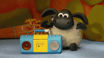 A Cartoon Sheep Is Sitting Next To A Blue And Yellow Radio GIF