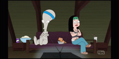 A Cartoon Shows A Man And A Woman Sitting On A Couch With Tbs Written On The Bottom GIF