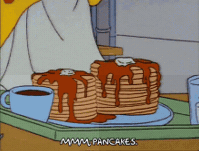 A Cartoon Shows A Stack Of Pancakes On A Tray GIF