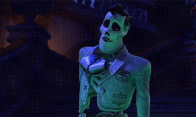 A Cartoon Skeleton In A Blue Suit And Tie GIF