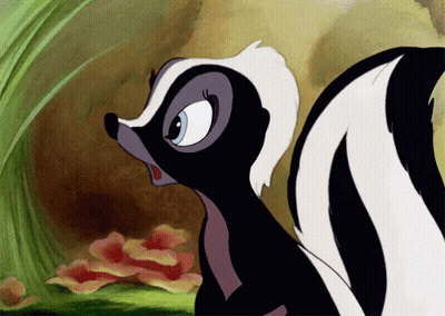 A Cartoon Skunk With A Blue Eye Is Looking At Something GIF