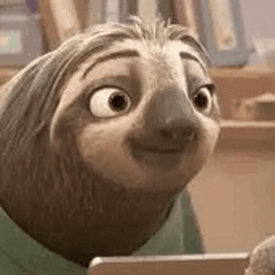 A Cartoon Sloth Is Smiling And Looking At A Tablet . GIF