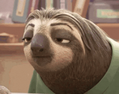 A Cartoon Sloth Wearing A Green Shirt Is Sitting At A Table . GIF