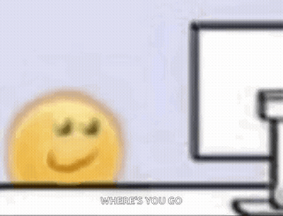 A Cartoon Smiley Face Is Sitting In Front Of A Computer Screen . GIF