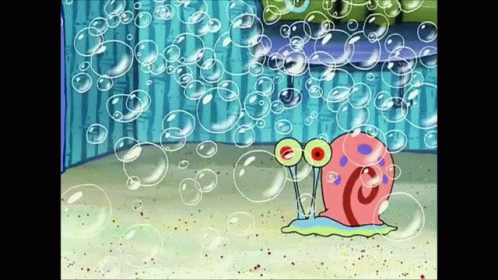 A Cartoon Snail Is Surrounded By Soap Bubbles In A Room GIF