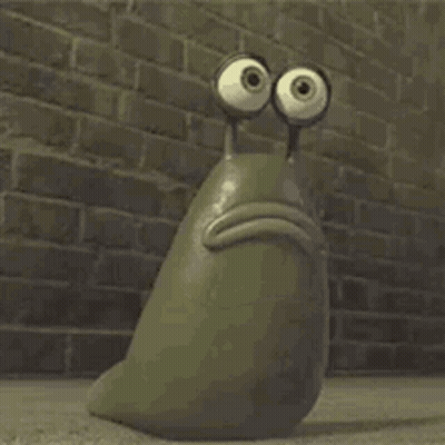 A Cartoon Snail With Big Eyes Is Sitting In Front Of A Brick Wall . GIF