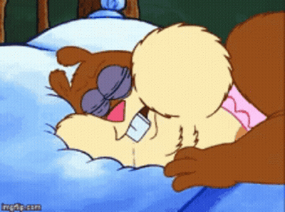 A Cartoon Squirrel Is Laying On A Bed With A Blue Blanket GIF