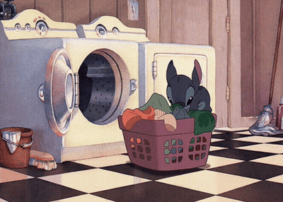 A Cartoon Stitch Is Sitting In A Laundry Basket GIF