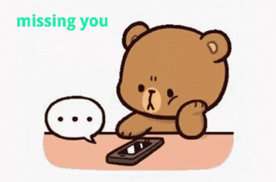 A Cartoon Teddy Bear Is Sitting At A Table With A Cell Phone And A Speech Bubble . GIF