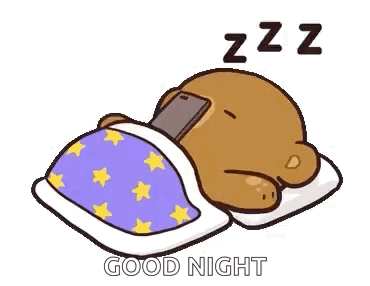 A Cartoon Teddy Bear Is Sleeping In A Bed With A Cell Phone On His Head . GIF
