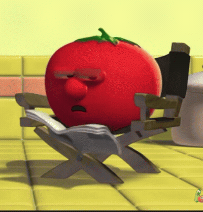 A Cartoon Tomato Is Sitting In A Director 'S Chair Reading A Book GIF