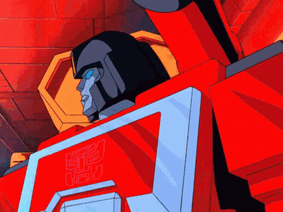 A Cartoon Transformer Is Waving His Hand In Front Of A Computer Screen GIF