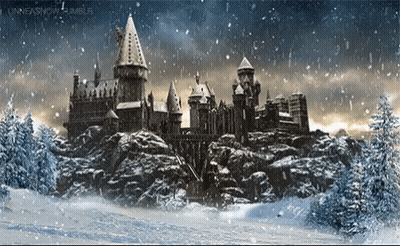 A Castle Is Surrounded By Snow Covered Trees And Rocks GIF