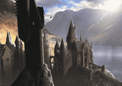 A Castle With A Mountain In The Background And A Few Birds Flying Around GIF