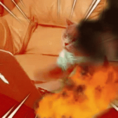 A Cat Is Laying On A Couch With A Fireball In The Background . GIF