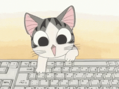 A Cat Is Peeking Over A Computer Keyboard GIF