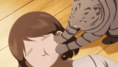 A Cat Is Petting A Woman 'S Ear While Laying On A Wooden Floor GIF