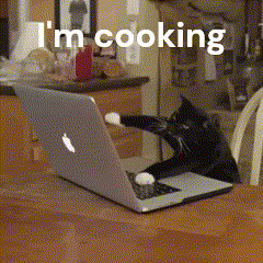 A Cat Is Reaching For A Laptop That Says I 'M Cooking On It GIF