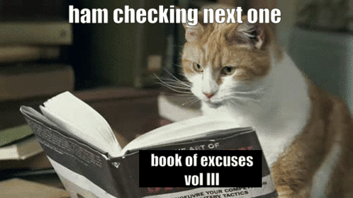 A Cat Is Reading A Book With The Caption Ham Checking Next One Book Of Excuses Vol Iii GIF