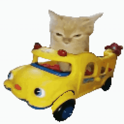 A Cat Is Sitting In A Yellow Toy Car GIF
