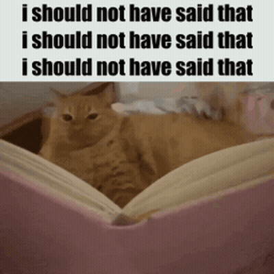 A Cat Is Sitting On Top Of An Open Book With The Words I Should Not Have Said That Written Below It . GIF