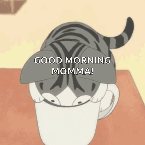 A Cat Is Sticking Its Head Out Of A Cup Of Coffee . GIF