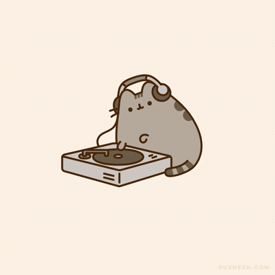 A Cat Wearing Headphones Is Playing A Record GIF
