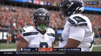 A Cbs NFL Broadcast Of A Football Game Between The Seahawks And The Cincinnati Titans GIF