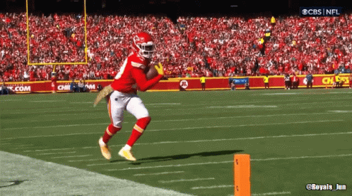 A Cbs Nfl Broadcast Of A Football Game Shows A Player Catching The Ball GIF