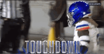 A Cbs Sports Ad Shows A Football Player Getting Ready To Touch Down GIF