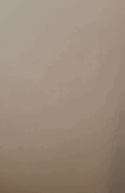 A Cell Phone Is Floating In The Air With A Picture Of A Person On The Screen . GIF