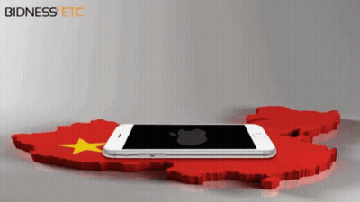 A Cell Phone Laying On Top Of A Red And Yellow Map With Bidness Etc Written On The Bottom GIF