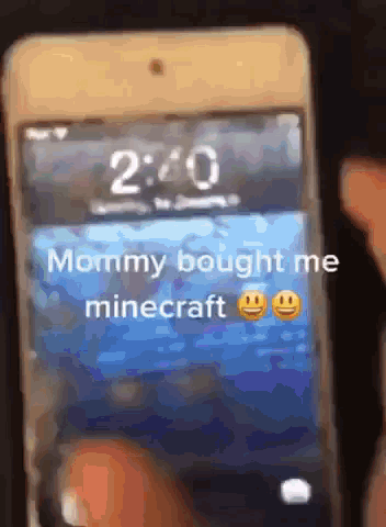 A Cell Phone With A Screen That Says " Mommy Bought Me Minecraft " On It GIF
