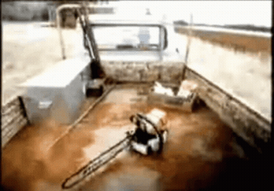 A Chainsaw Is Sitting In The Back Of A Car GIF