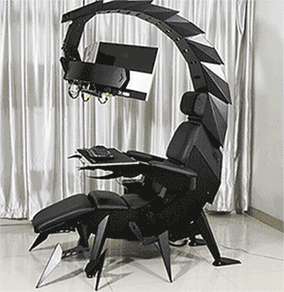 A Chair That Looks Like A Scorpion With A Computer On Top GIF
