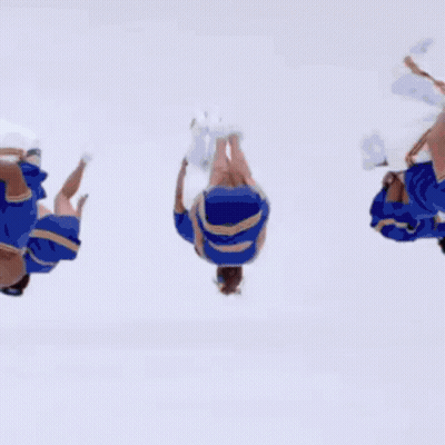 A Cheerleader Is Jumping In The Air With Her Arms Out GIF