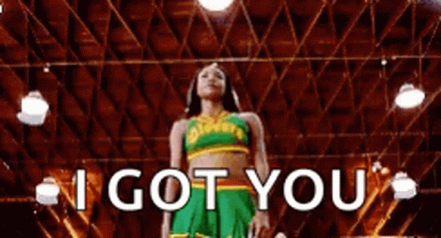 A Cheerleader Is Standing In A Gym With The Words `` I Got You '' Written On The Screen . GIF